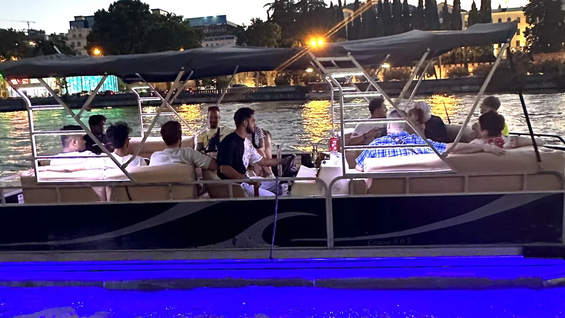 Guests aboard the Boss Tours boat on the Kura river in the evening