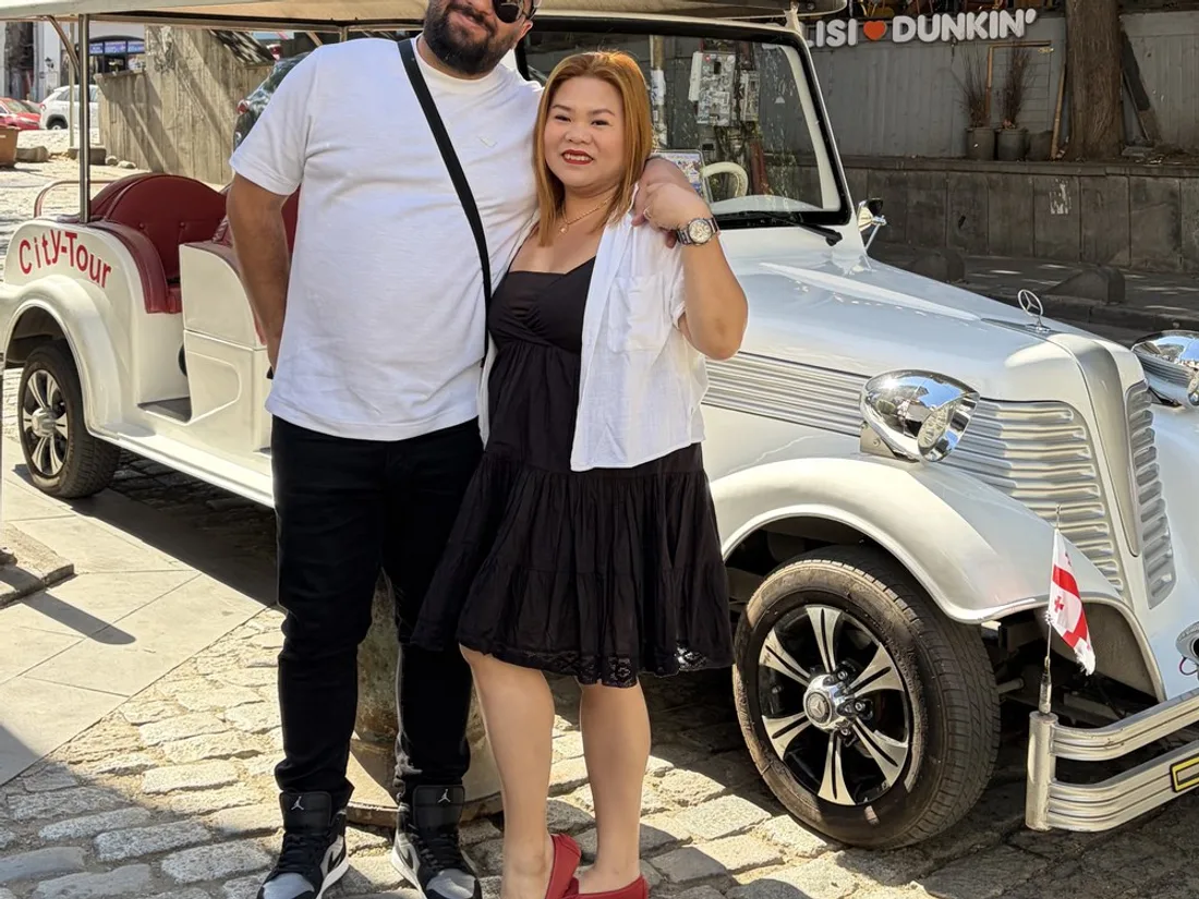 Guests enjoying the retro car tour of Tbilisi