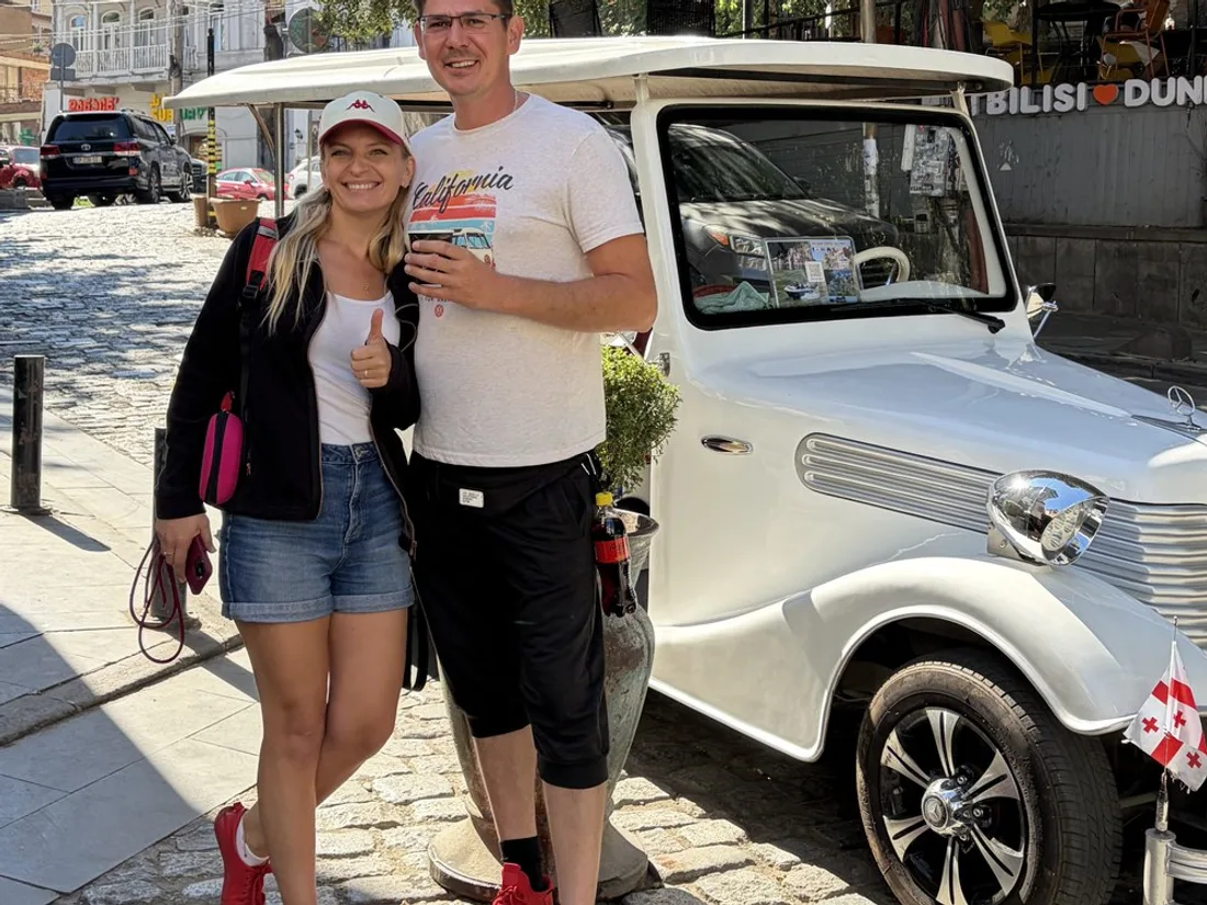 Guests on the Boss Tours retro car ride